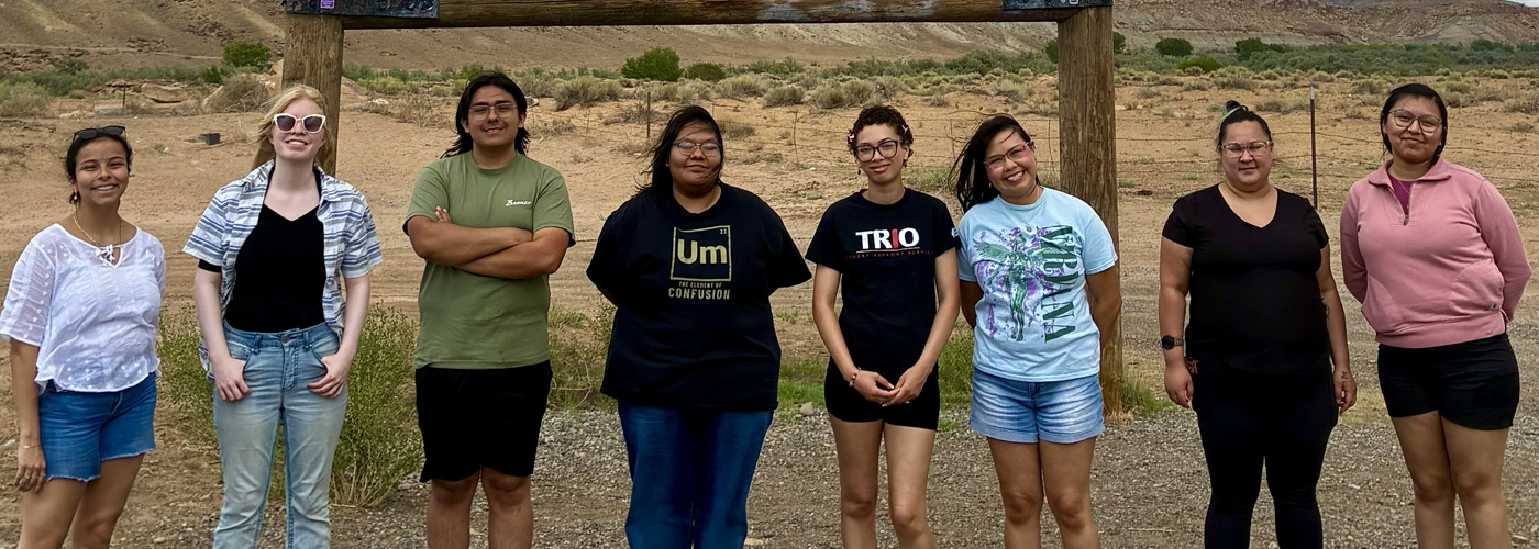 Group of TRIO students standing in front of a sign in Colorado